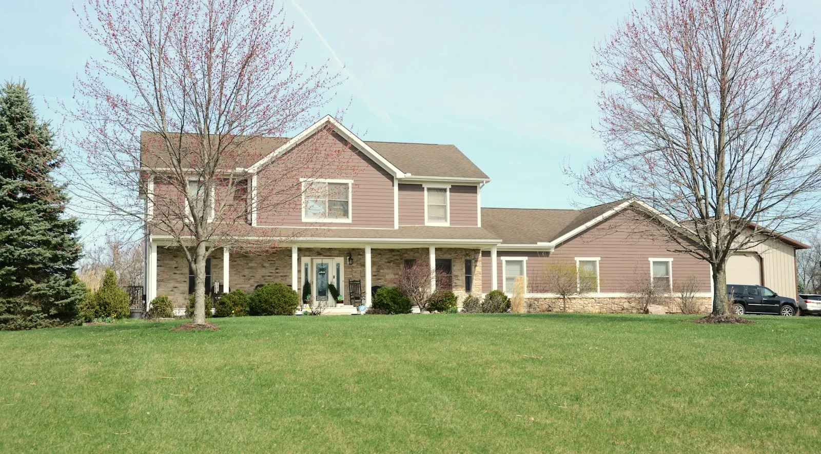 A neatly maintained green lawn beside a home